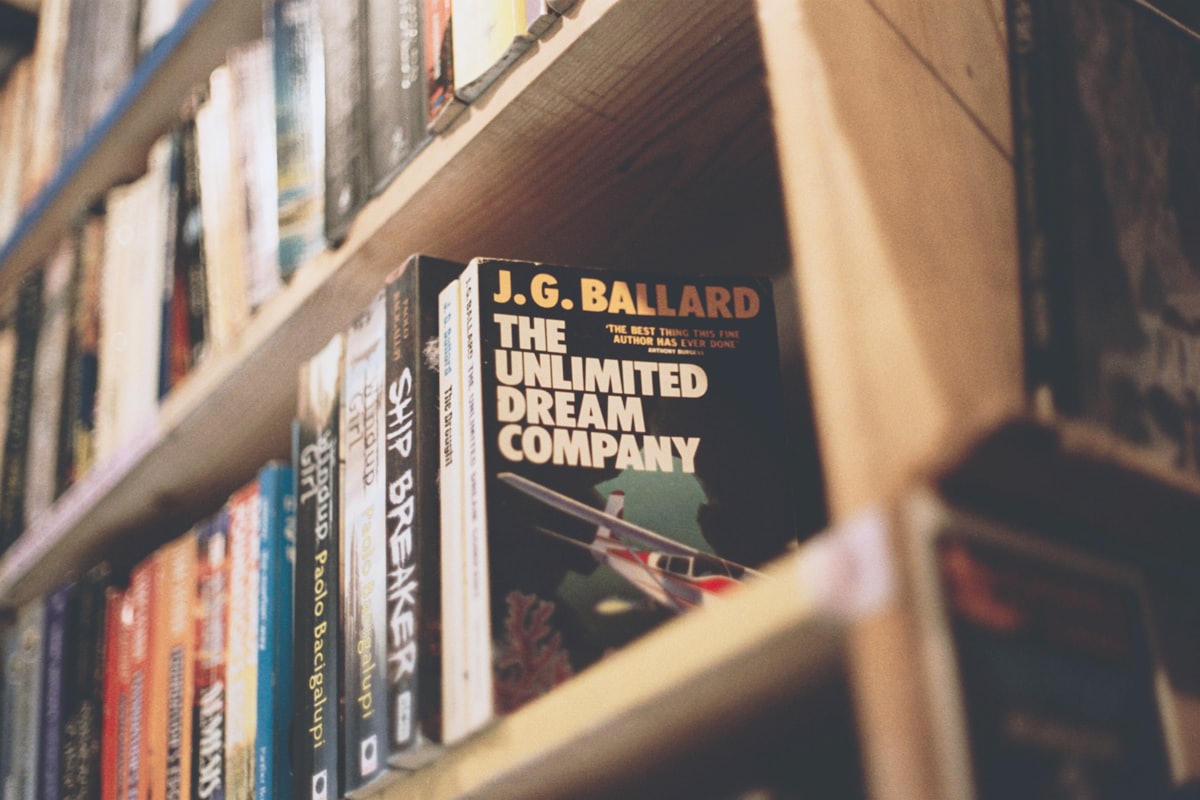 A shelf of well-loved paperback books at a book club